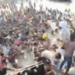 in a video from flood impacted samastipur the chaotic distribution of relief supplies is captured as men on a boat recklessly toss essential materials into waist deep water