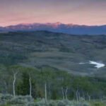 the wyoming property sits at about 8500 feet and covers a landscape surrounded by mountain ranges photo wyofile