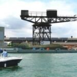 a 150 foot historic crane overlooking englands cowes waterfront faced the risk of collapse after years of legal appeals the council recovered the cost of emergency repairs from its former owners