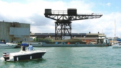 a 150 foot historic crane overlooking englands cowes waterfront faced the risk of collapse after years of legal appeals the council recovered the cost of emergency repairs from its former owners