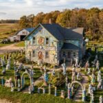 a wisconsin dairy farmer sprained his ankle and began sculpting 15 years later nick engelbert had transformed his farmhouse into grandview with over 40 statues and colourful decorations
