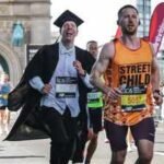 an oxford professor ran the london marathon dressed as an academic in 2 hours 55 minutes he broke a guinness record and raised money for a childrens hospice