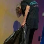 brooklyn green spotted an elderly worker emptying rubbish at an amc theatre in tennessee and recorded a video of her