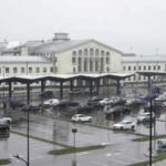 cars wait in front of the arrival terminal at vilnius ciurlionis international airport in vilnius