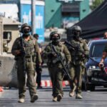 israeli forces stand guard near shooting scene in hebron in the israeli occupied west bank