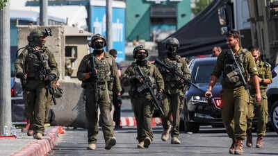 israeli forces stand guard near shooting scene in hebron in the israeli occupied west bank